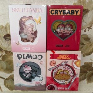 NWT POPMART BADGES FT. CRYBABY, DIMOO AND SKULLPANDA AND PUCKY !!